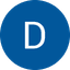 White letter D on a blue circle icon, possibly a transit or service logo.