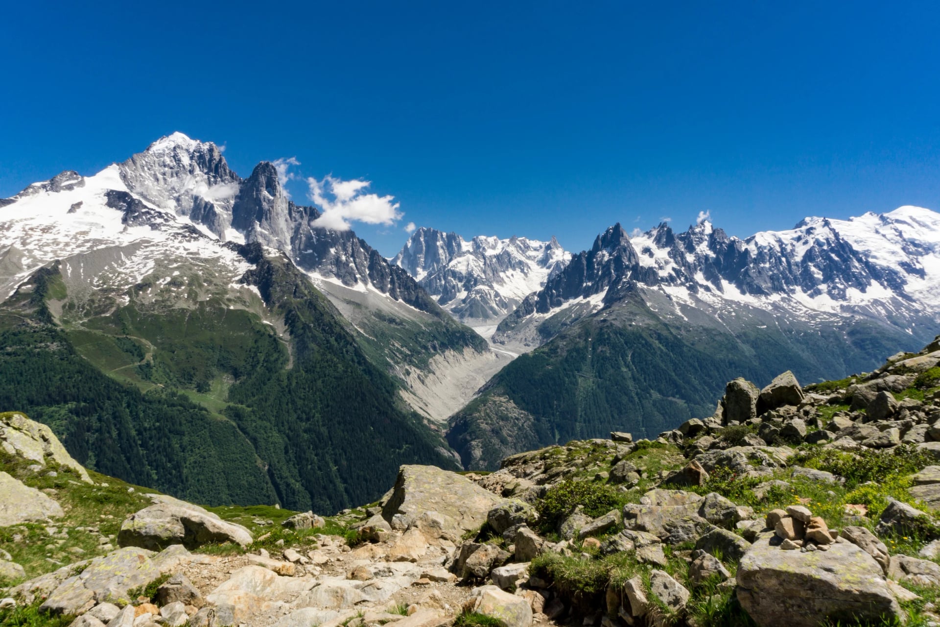 Mont Blanc massif on a sunny day in June. Alps.